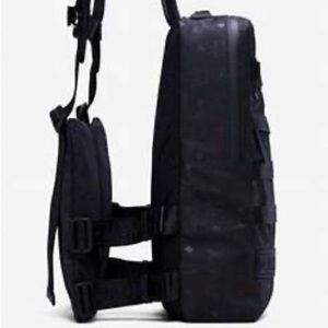 Large black MCM logo backpack with additional pouches on straps